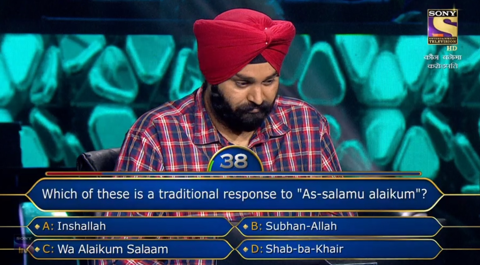 Ques : Which of these is a traditional response to “As-salamu alaikum”?