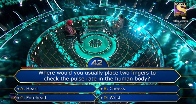 Ques : Where would you usually place two fingers to check the pulse rate in the human body?
